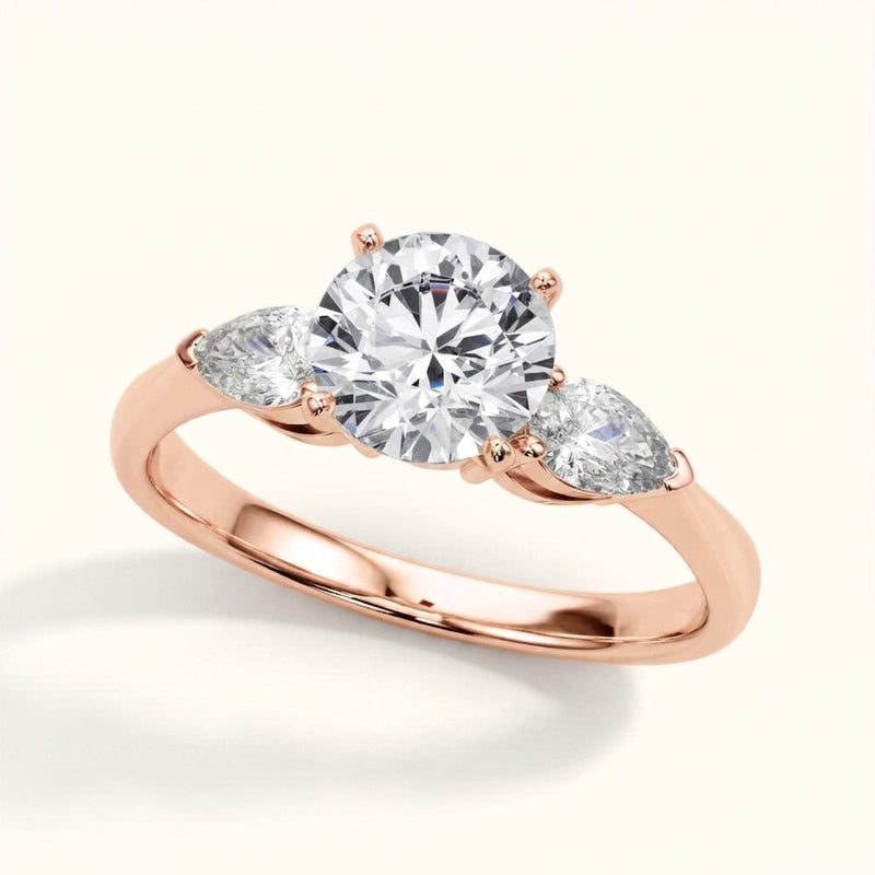 Three-Stone Engagement Ring (Pear Center) — Rose Gold