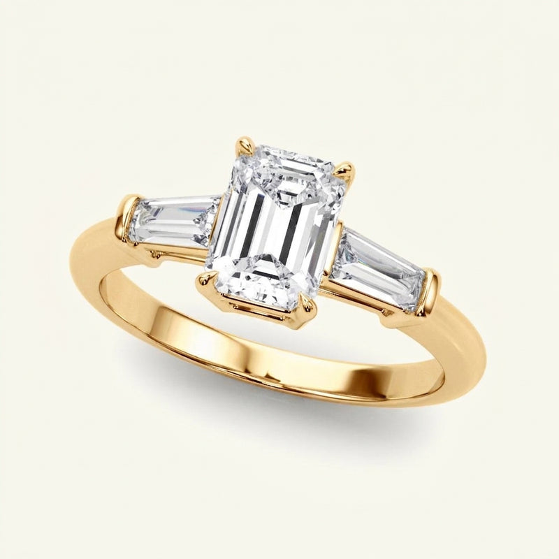 Three-Stone Ring Emerald Center Taper Baquette Sides Engagement Ring — Yellow Gold